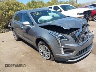 2023 Cadillac XT5 FWD Premium Luxury z VIN 1GYKNCRS3PZ143699, wystawiony jako IAAI lot #42135837 z przebiegiem 57 546 mil mil oraz . Historia ofert i sprzedaży dostępna na DreamBid. Obrazek 1.