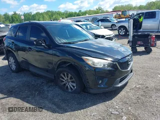 2014 Mazda CX-5 Touring z VIN JM3KE2CY3E0330365, wystawiony jako IAAI lot #42187064 z przebiegiem 167 931 mil mil oraz . Historia ofert i sprzedaży dostępna na DreamBid. Obrazek 1.
