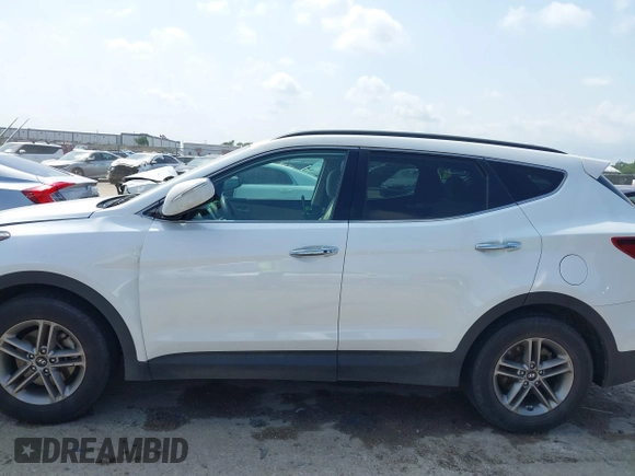 2018 Hyundai Santa Fe 2.4L z VIN 5NMZUDLB3JH055771, wystawiony jako IAAI lot #42126058 z przebiegiem 142 991 mil mil oraz . Historia ofert i sprzedaży dostępna na DreamBid. Obrazek 14.
