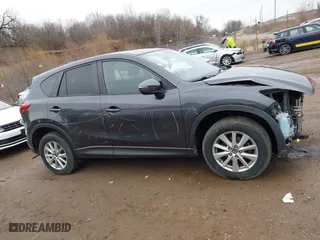 2016 Mazda CX-5 Touring with VIN JM3KE4CY7G0715507, listed as a IAAI auction lot 41699610 with 108,206 mi miles. Bid and sale history available at carsss.com. Image 14.