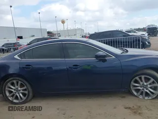 2017 Mazda Mazda6 Touring with VIN JM1GL1V54H1107722, listed as a IAAI auction lot 41521257 with 142,129 mi miles. Bid and sale history available at carsss.com. Image 14.