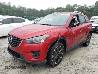 2016 Mazda CX-5 Grand Touring z VIN JM3KE2DY8G0623423, wystawiony jako Copart lot #58599545 z przebiegiem 131 932 mil mil oraz Szkoda całkowita • Salvage title. Historia ofert i sprzedaży dostępna na DreamBid. Obrazek 1.
