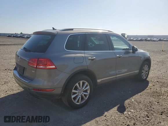 2013 Volkswagen Touareg Lux z VIN WVGEF9BP8DD009350, wystawiony jako Copart lot #55775385 z przebiegiem 165 958 mil mil oraz Czysty tytuł • Clean title. Historia ofert i sprzedaży dostępna na DreamBid. Obrazek 3.