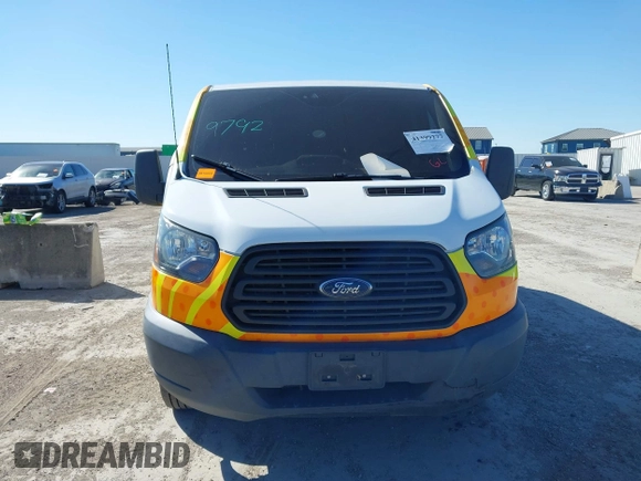 2016 Ford Transit Cargo with VIN 1FTYE1ZM1GKA89091, listed as a IAAI auction lot 41399277 with 137,070 mi miles and . Bid and sale history available at DreamBid. Image 12.