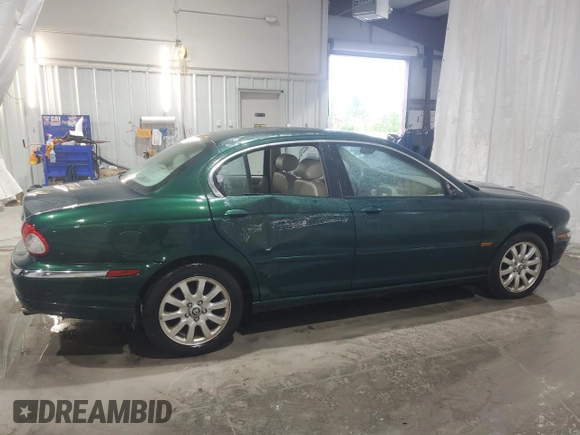 2003 Jaguar X-Type 2.5L Manual z VIN SAJEA51D63XD54591, wystawiony jako Copart lot #57638355 z przebiegiem 93 905 mil mil oraz Szkoda całkowita • Salvage title. Historia ofert i sprzedaży dostępna na DreamBid. Obrazek 3.