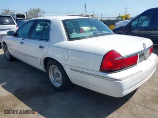 1998 Mercury Grand Marquis LS with VIN 2MEFM75W1WX629909, listed as a IAAI auction lot 41992694 with 105,426 mi miles. Bid and sale history available at carsss.com. Image 3.