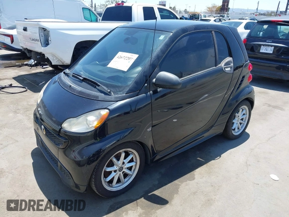 2014 Smart fortwo Pure with VIN WMEEJ3BA1EK752202, listed as a IAAI auction lot 42672207 with 65,736 mi miles and . Bid and sale history available at DreamBid. Image 2.