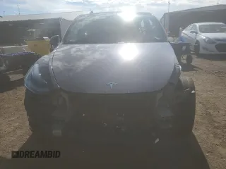 2023 Tesla Model Y Long Range z VIN 7SAYGDEE7PF965446, wystawiony jako Copart lot #54710375 z przebiegiem 23 807 mil mil oraz Szkoda całkowita • Salvage title. Historia ofert i sprzedaży dostępna na DreamBid. Obrazek 5.