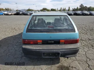 1992 Geo Metro z VIN 2C1MS2465N6782913, wystawiony jako Copart lot #77405574 z przebiegiem 77 080 mil mil oraz Szkody całkowita. Historia ofert i sprzedaży dostępna na DreamBid. Obrazek 6.
