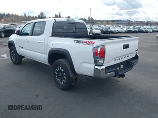 2023 Toyota Tacoma SR z VIN 3TMCZ5AN0PM541700, wystawiony jako IAAI lot #41819408 z przebiegiem 14 216 mil mil oraz . Historia ofert i sprzedaży dostępna na DreamBid. Obrazek 3.