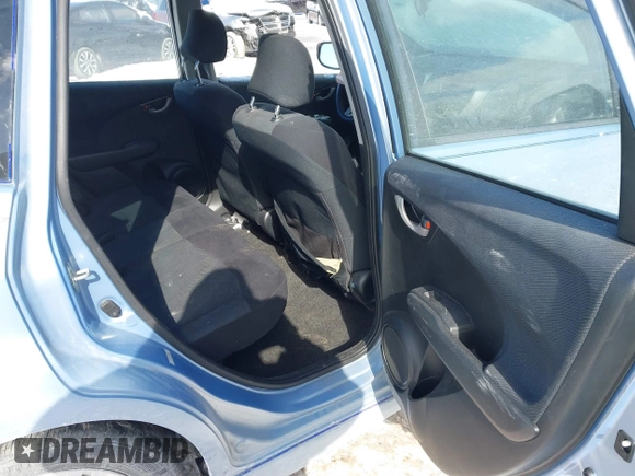 2009 Honda Fit Sport with VIN JHMGE884X9S026613, listed as a IAAI auction lot 41593112 with 144,736 mi miles. Bid and sale history available at carsss.com. Image 8.