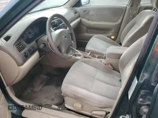 2001 Mazda 626 LX with VIN 1YVGF22C215245817, listed as a Copart auction lot 80491144 with 147,603 mi miles and Salvage Title. Bid and sale history available at carsss.com. Image 7.
