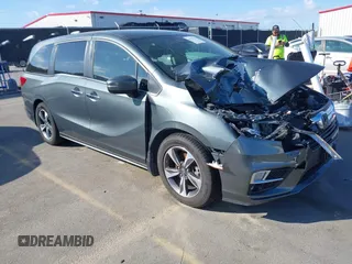 2020 Honda Odyssey Touring z VIN 5FNRL6H8XLB035047, wystawiony jako IAAI lot #41794343 z przebiegiem 57 537 mil mil oraz . Historia ofert i sprzedaży dostępna na DreamBid. Obrazek 1.