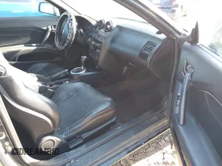 2003 Hyundai Tiburon GT z VIN KMHHN65FX3U076547, wystawiony jako IAAI lot #42015723 z przebiegiem 174 909 mil mil oraz . Historia ofert i sprzedaży dostępna na DreamBid. Obrazek 5.
