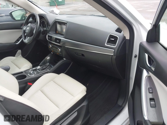 2016 Mazda CX-5 Grand Touring z VIN JM3KE4DY0G0705884, wystawiony jako IAAI lot #42016910 z przebiegiem 73 324 mil mil oraz . Historia ofert i sprzedaży dostępna na DreamBid. Obrazek 5.