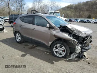 2011 Hyundai Tucson Limited with VIN KM8JUCAC2BU200517, listed as a Copart auction lot 53252005 with 158,502 mi miles and Salvage Title. Bid and sale history available at DreamBid. Image 4.