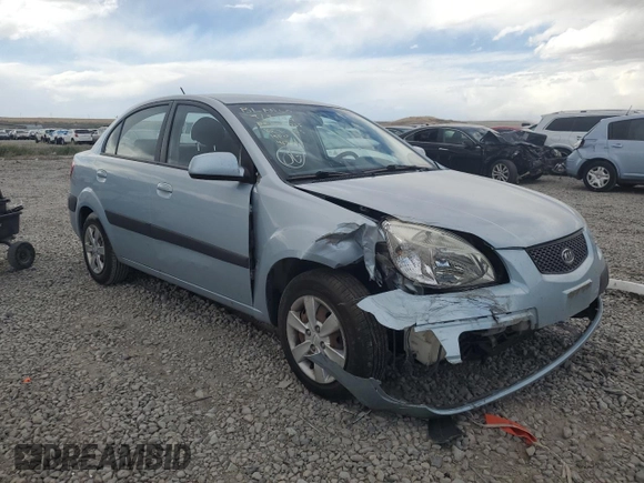 2009 Kia Rio LX with VIN KNADE223496469797, listed as a Copart auction lot 71005774 with 130,675 mi miles and Salvage Title. Bid and sale history available at DreamBid. Image 4.
