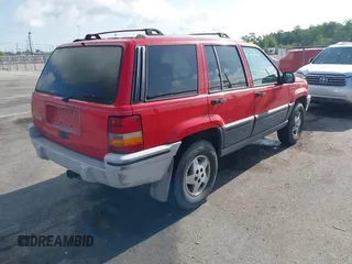 1995 Jeep Grand Cherokee Laredo with VIN 1J4FX58S9SC686074, listed as a IAAI auction lot 42451786 with 82,249 mi miles and . Bid and sale history available at DreamBid. Image 4.