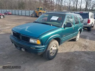 1997 Oldsmobile Bravada with VIN 1GHDT13W9V2705528, listed as a IAAI auction lot 41583837 with 284,281 mi miles. Bid and sale history available at carsss.com. Image 2.