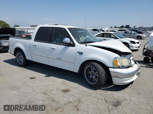 2001 Ford F-150 XLT with VIN 1FTRW07651KC49772, listed as a Copart auction lot 59904815 with 145,639 mi miles and Salvage title. Bid and sale history available at DreamBid. Image 4.
