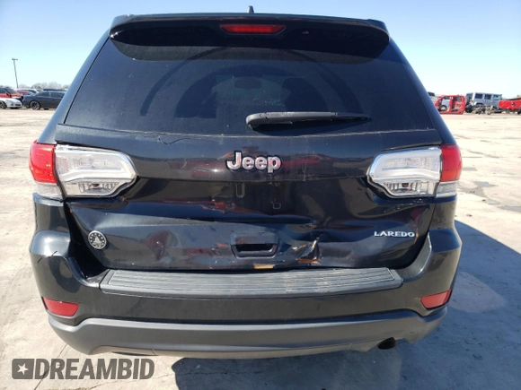 2014 Jeep Grand Cherokee Laredo with VIN 1C4RJEAGXEC217249, listed as a Copart auction lot 48585195 with 131,635 mi miles and Salvage Title. Bid and sale history available at DreamBid. Image 6.