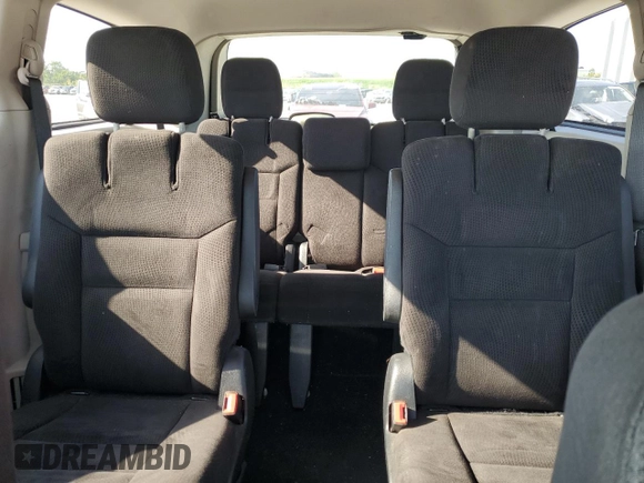 2014 Dodge Grand Caravan SXT z VIN 2C4RDGCG6ER223900, wystawiony jako Copart lot #56960965 z przebiegiem 101 275 mil mil oraz Szkoda całkowita • Salvage title. Historia ofert i sprzedaży dostępna na DreamBid. Obrazek 10.