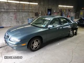 2000 Mazda Millenia with VIN JM1TA2212Y1610919, listed as a Copart auction lot 80375014 with 127,938 mi miles and Salvage Title. Bid and sale history available at DreamBid. Image 1.
