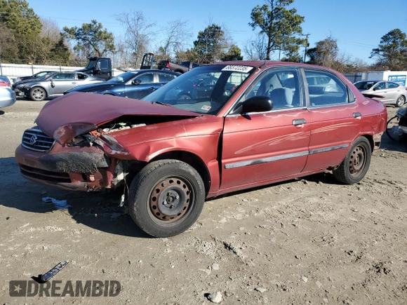 2001 Suzuki Esteem GL z VIN JS2GB41S915202412, wystawiony jako Copart lot #88372235 z przebiegiem 301 061 mil mil oraz Szkoda całkowita • Salvage title. Historia ofert i sprzedaży dostępna na DreamBid. Obrazek 1.