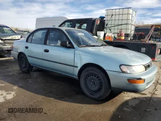 1994 Toyota Corolla Deluxe with VIN JT2AE09B4R0067104, listed as a Copart auction lot 83565064 with 207,923 mi miles and Salvage title. Bid and sale history available at DreamBid. Image 4.