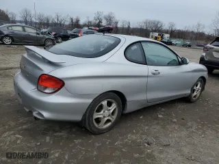 2001 Hyundai Tiburon with VIN KMHJG35F31U224416, listed as a Copart auction lot 83243684 with 59,473 mi miles and Salvage Title. Bid and sale history available at carsss.com. Image 3.