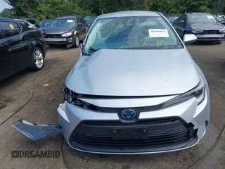 2023 Toyota Corolla Hybrid LE with VIN JTDBDMHE5P3000797, listed as a IAAI auction lot 40206015 with 22,371 mi miles. Bid and sale history available at carsss.com. Image 13.