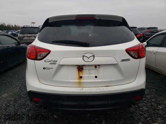 2014 Mazda CX-5 Touring z VIN JM3KE4CY1E0406726, wystawiony jako Copart lot #54652065 z przebiegiem 245 491 mil mil oraz Szkoda całkowita • Salvage title. Historia ofert i sprzedaży dostępna na DreamBid. Obrazek 6.