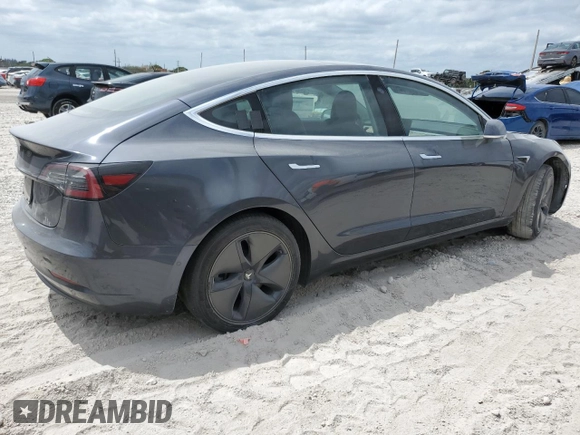 2019 Tesla Model 3 Mid Range z VIN 5YJ3E1EA4KF434741, wystawiony jako Copart lot #53857935 z przebiegiem Nie podano mil oraz Szkody całkowita. Historia ofert i sprzedaży dostępna na DreamBid. Obrazek 3.
