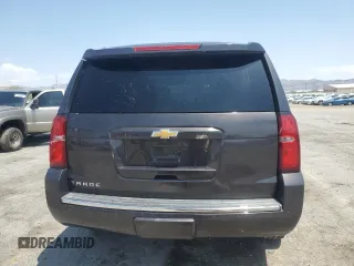 2015 Chevrolet Tahoe LTZ with VIN 1GNSKCKC2FR157035, listed as a Copart auction lot 59990415 with Not provided miles and Salvage title. Bid and sale history available at DreamBid. Image 6.