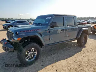 2024 Jeep Gladiator Mojave с VIN 1C6JJTEGXRL115913, выставлен на аукционе Copart как лот 64842115 с пробегом 14 432 миль миль и Списание • Salvage title. История ставок и продаж доступна на DreamBid. Изображение 1.