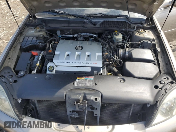 2002 Cadillac DeVille DHS z VIN 1G6KE57Y32U107755, wystawiony jako Copart lot #52811235 z przebiegiem 111 141 mil mil oraz Nie do naprawy. Historia ofert i sprzedaży dostępna na DreamBid. Obrazek 11.