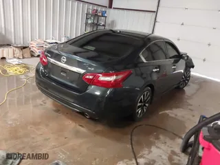 2018 Nissan Altima 2.5 SV with VIN 1N4AL3AP1JC276024, listed as a IAAI auction lot 41271383 with 121,088 mi miles. Bid and sale history available at carsss.com. Image 4.