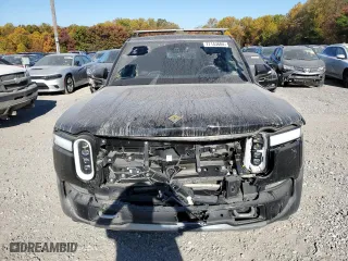 2022 Rivian R1S Launch Edition with VIN 7PDSGABL6NN001531, listed as a Copart auction lot 77143684 with 27,241 mi miles and Salvage Title. Bid and sale history available at carsss.com. Image 5.
