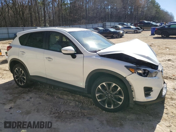 2016 Mazda CX-5 Grand Touring with VIN JM3KE4DY6G0857197, listed as a Copart auction lot 44500955 with 76,088 mi miles and Salvage Title. Bid and sale history available at DreamBid. Image 4.
