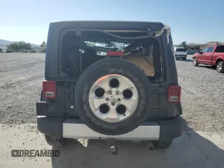 2015 Jeep Wrangler Sahara with VIN 1C4AJWBG5FL733795, listed as a Copart auction lot 61998255 with 86,655 mi miles and Salvage title. Bid and sale history available at DreamBid. Image 6.