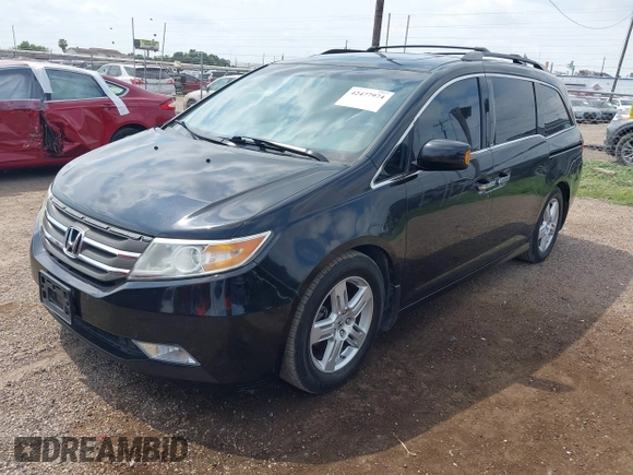 2013 Honda Odyssey Touring with VIN 5FNRL5H95DB086041, listed as a IAAI auction lot 42477974 with 213,343 mi miles and . Bid and sale history available at DreamBid. Image 17.