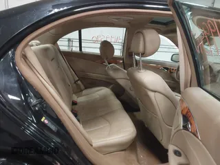 2007 Mercedes-Benz E-Class 3.5L with VIN WDBUF87XX7X214060, listed as a IAAI auction lot 41199590 with 136,011 mi miles. Bid and sale history available at carsss.com. Image 8.