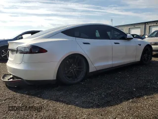 2013 Tesla Model S с VIN 5YJSA1CG2DFP25370, выставлен на аукционе Copart как лот 64003825 с пробегом 85 656 миль миль и Списание • Salvage title. История ставок и продаж доступна на DreamBid. Изображение 3.