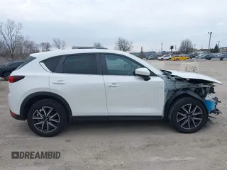 2018 Mazda CX-5 Touring z VIN JM3KFBCM6J0323107, wystawiony jako IAAI lot #41895519 z przebiegiem 86 124 mil mil oraz . Historia ofert i sprzedaży dostępna na DreamBid. Obrazek 13.