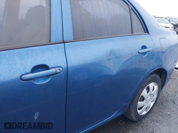 2009 Toyota Corolla with VIN JTDBL40E999052447, listed as a IAAI auction lot 41914900 with 133,676 mi miles. Bid and sale history available at carsss.com. Image 6.