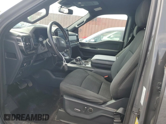 2021 Ford F-150 XL with VIN 1FTFW1E8XMFC22903, listed as a Copart auction lot 57840855 with 66,127 mi miles and Salvage title. Bid and sale history available at DreamBid. Image 7.