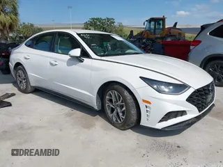 2023 Hyundai Sonata SEL z VIN KMHL64JA0PA280223, wystawiony jako IAAI lot #41996995 z przebiegiem 10 620 mil mil oraz . Historia ofert i sprzedaży dostępna na DreamBid. Obrazek 1.
