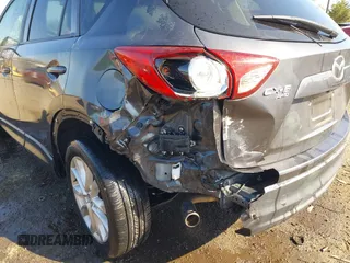 2014 Mazda CX-5 Grand Touring with VIN JM3KE4DY2E0312952, listed as a IAAI auction lot 42138721 with 99,993 mi miles and . Bid and sale history available at DreamBid. Image 17.