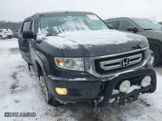 2011 Honda Ridgeline RTS with VIN 5FPYK1F48BB005889, listed as a IAAI auction lot 41268938 with 146,974 mi miles. Bid and sale history available at carsss.com. Image 1.