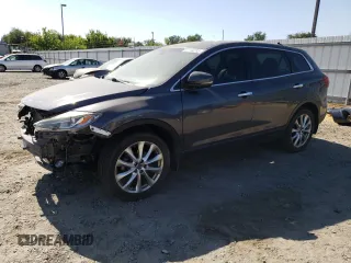 2014 Mazda CX-9 Grand Touring с VIN JM3TB3DA4E0426266, выставлен на аукционе Copart как лот 61184285 с пробегом 96 109 миль миль и Списание • Salvage title. История ставок и продаж доступна на DreamBid. Изображение 1.